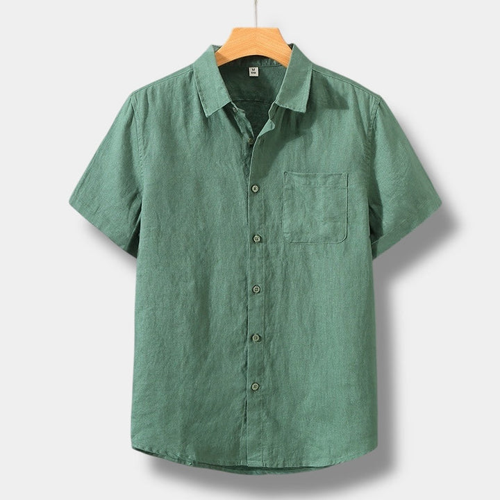 Green men's summer linen button up shirt with short sleeves, collar, and front pocket