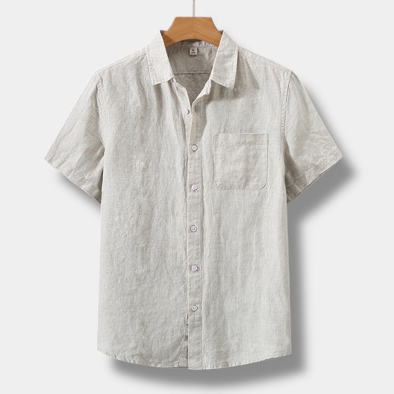 Beige men's summer linen short sleeve button up shirt with chest pocket and collared neckline