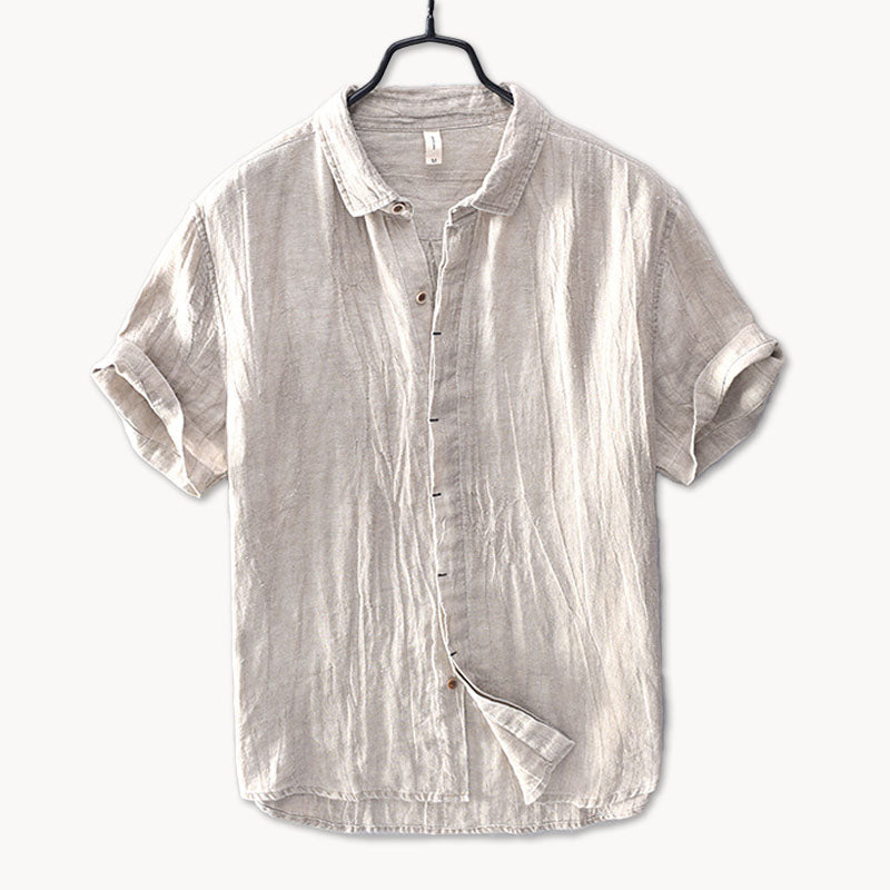 Dark gray men's linen short sleeve shirt with button front and rolled sleeves