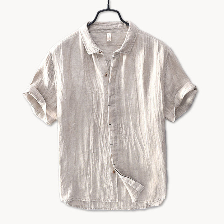 Dark gray men's linen short sleeve shirt with button front and rolled sleeves