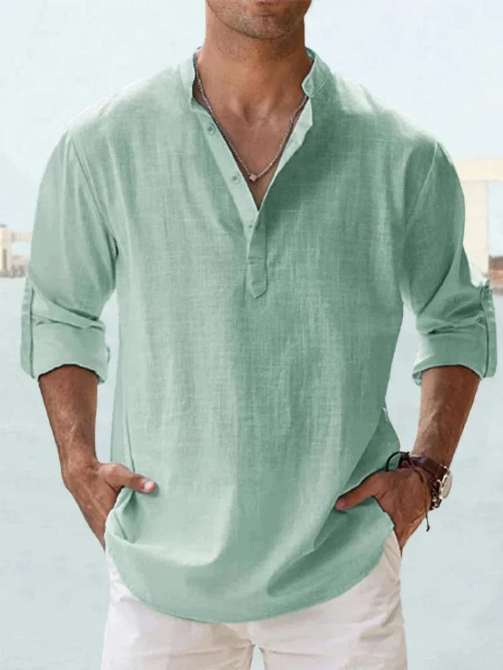 Mint green men's linen V neck long sleeve shirt with rolled cuffs and loose drape