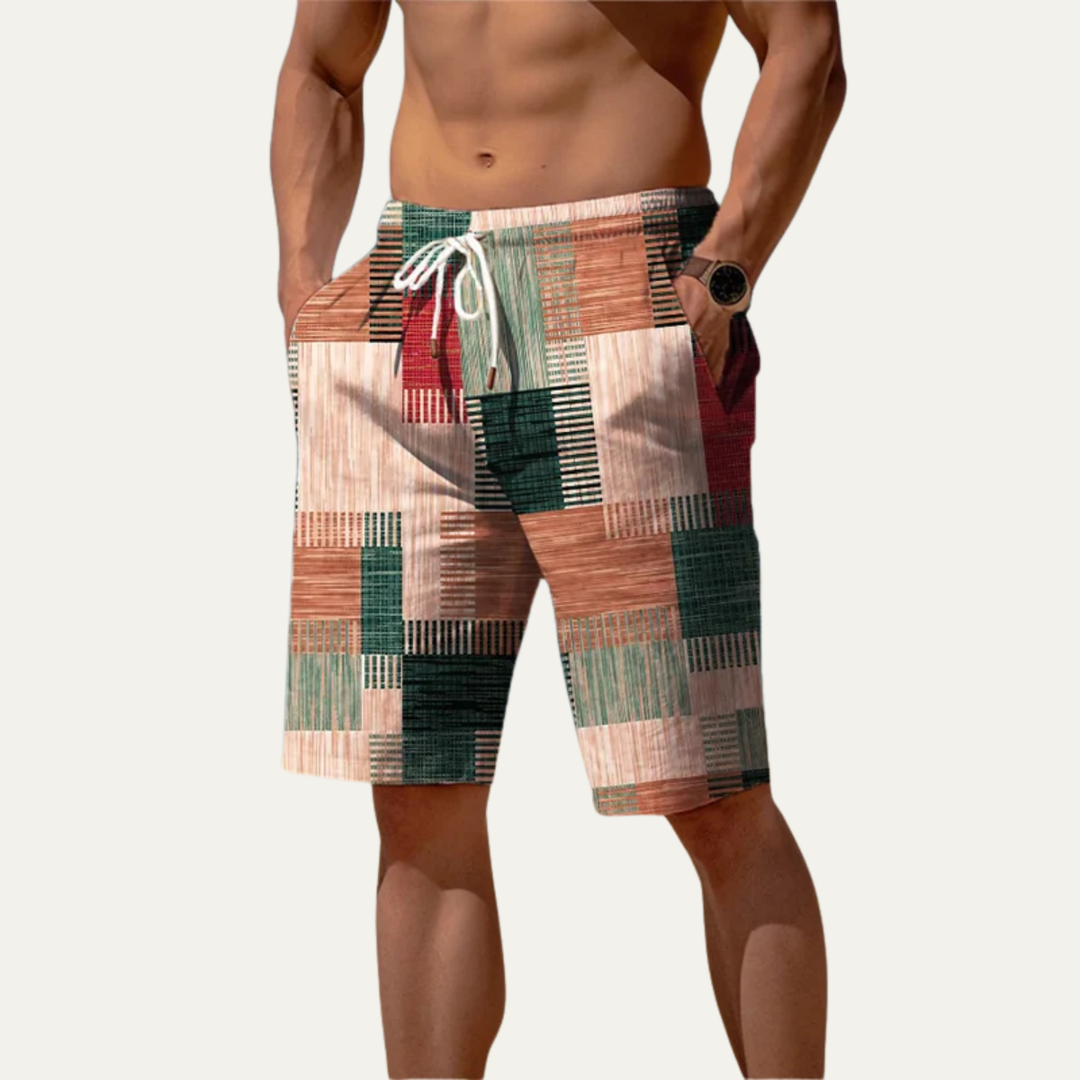 Men's summer shorts in green, peach and cream patchwork check design with relaxed fit