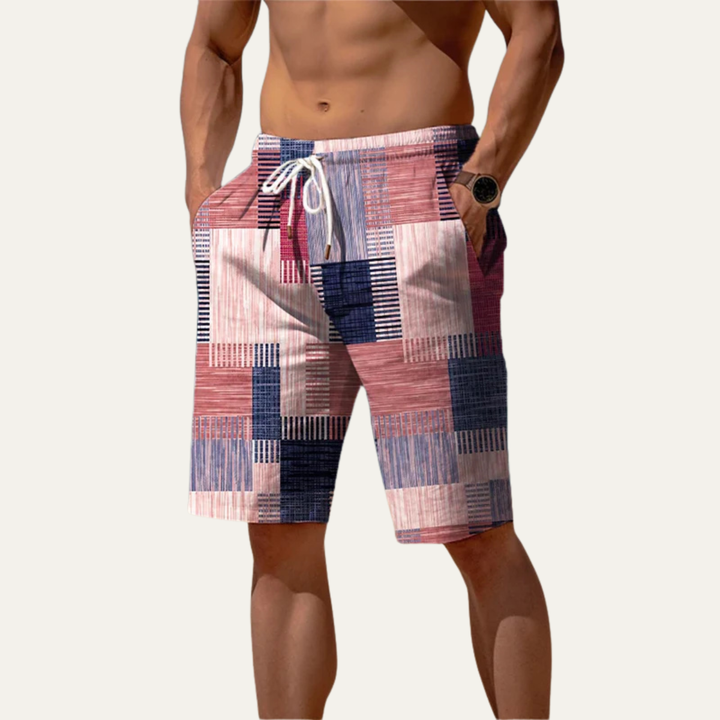 Men's knee length shorts with pink, navy and cream patchwork check print and white drawstring