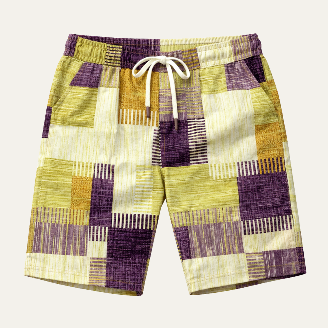 Men's knee length shorts with purple, yellow and cream patchwork check pattern and drawstring waist