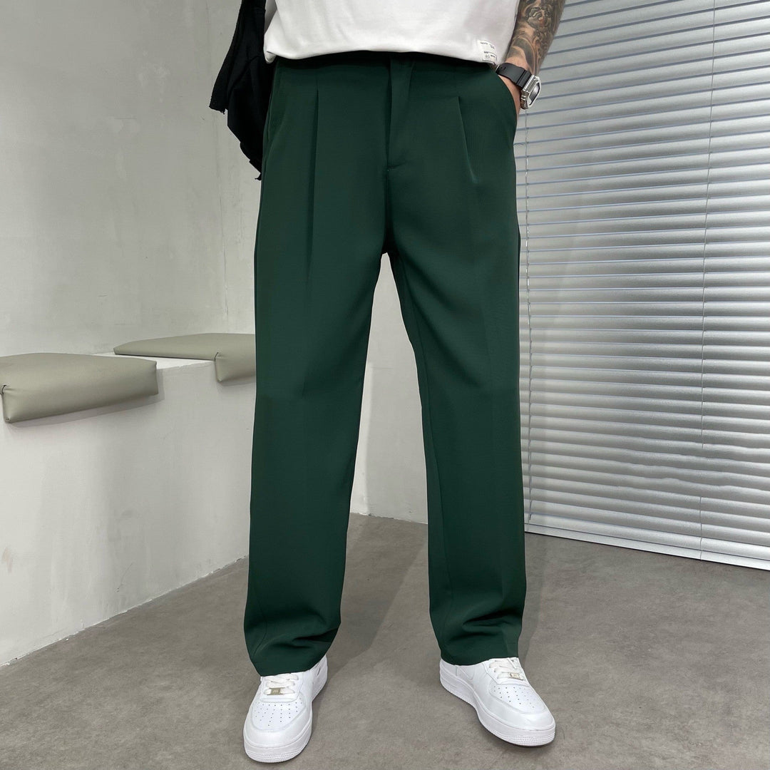 Color selection display of men's pleated straight leg linen pants in black, white, gray, brown, and green