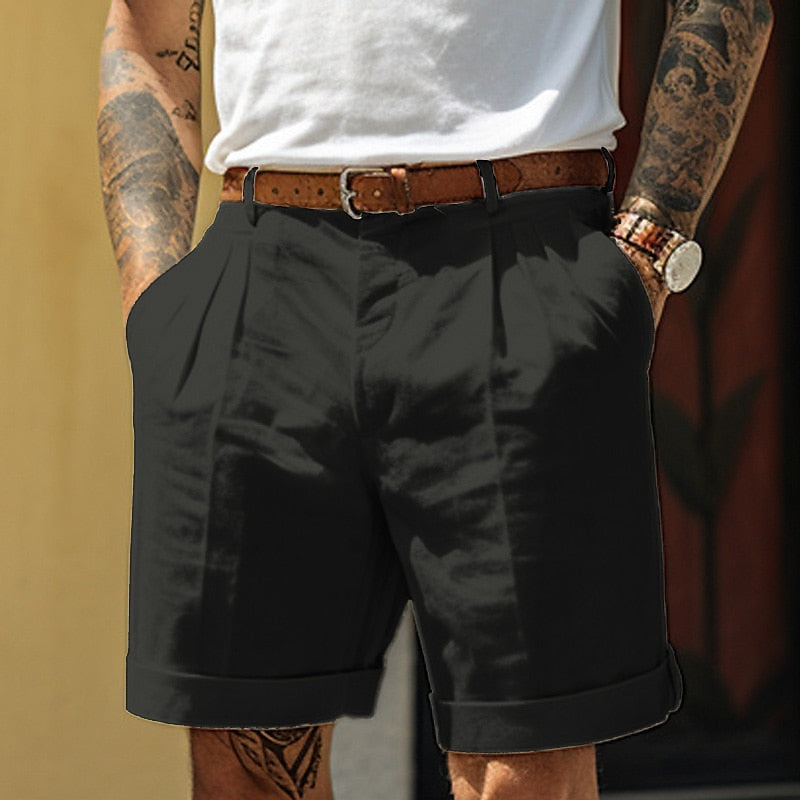 Black pleated tailored shorts for men with brown belt, cuffed legs and front pleats