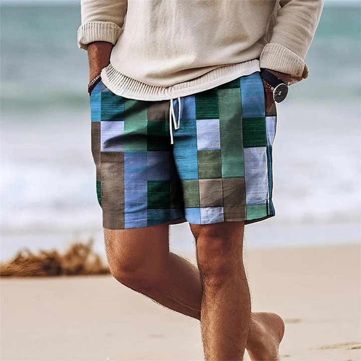 Men's board shorts swimsuit with pockets, blue and green patchwork print with drawstring waist