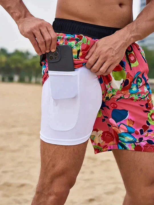Red multicolor print men's swim shorts with white liner shorts and side phone pocket detail