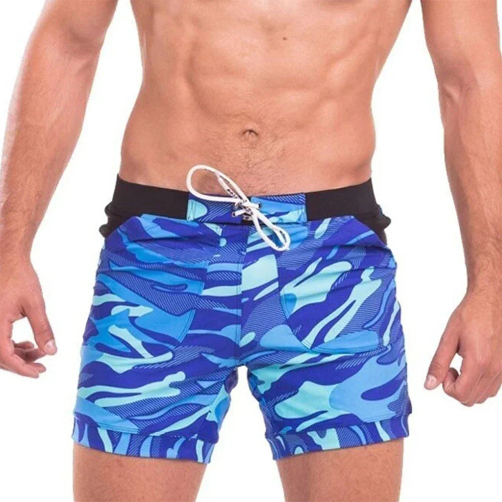 Blue camo men's quick dry swim shorts with black waistband and white drawstring, front view