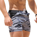 Gray camo men's swim shorts close-up from side, quick dry swimsuit with black waistband and tie