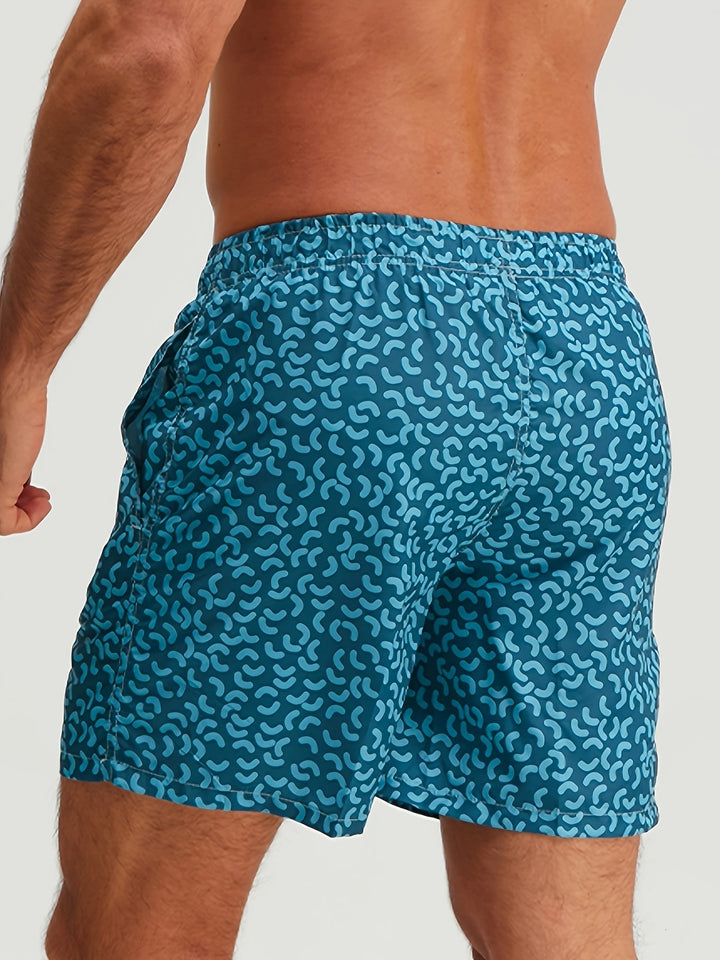 Back view of blue patterned swim shorts for men with elastic waist and side pockets