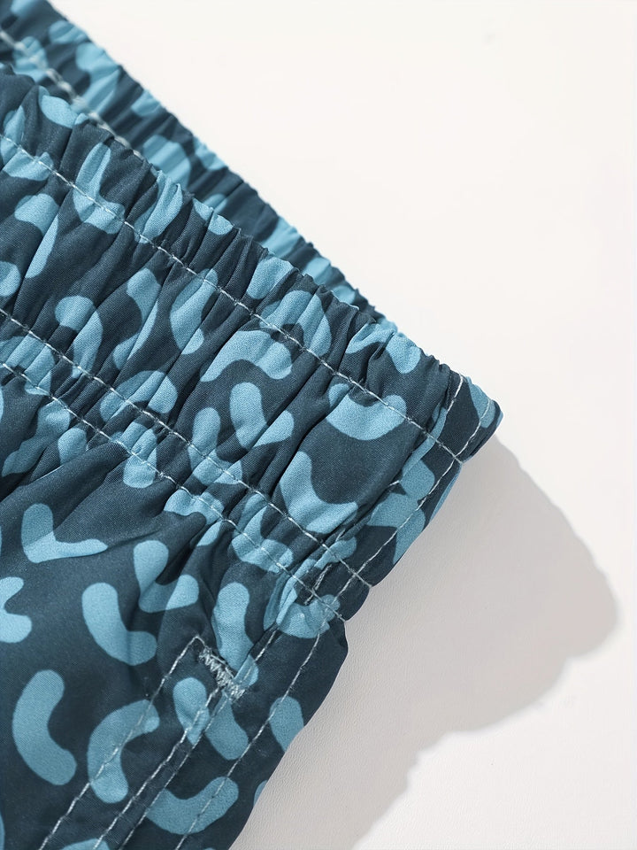 Front view of men’s printed swim shorts with light blue drawstring and relaxed fit