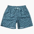 Flat lay of men’s summer printed swim shorts with elastic waist, drawstring, and abstract pattern