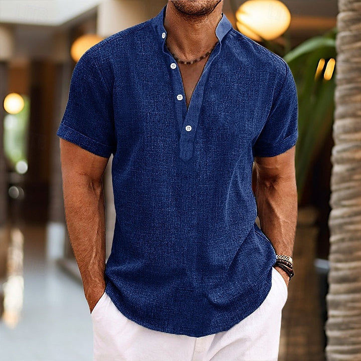 Dark blue men's short sleeve band collar shirt with textured fabric and relaxed fit