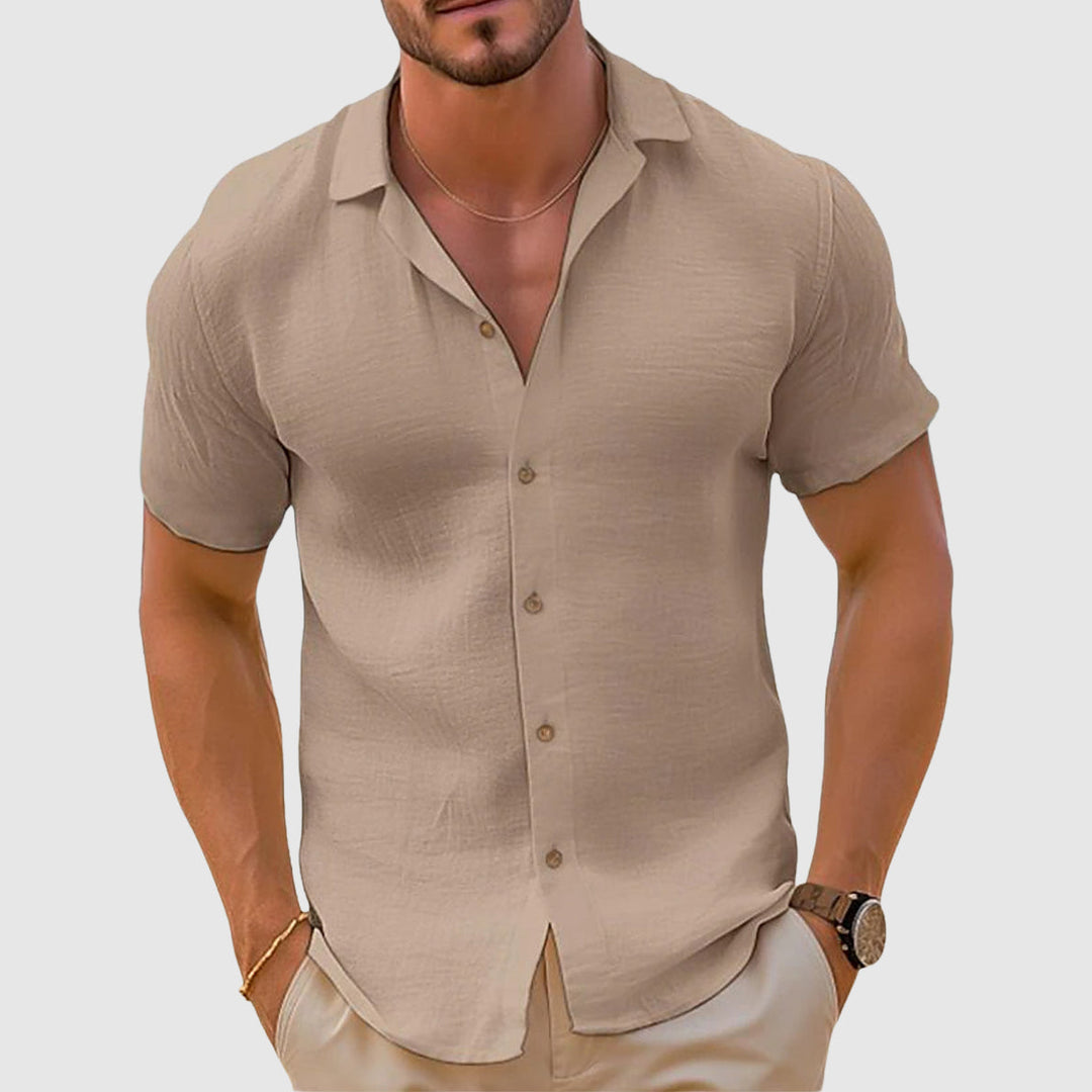 Beige men's summer short sleeve button up shirt with open collar and lightweight linen look
