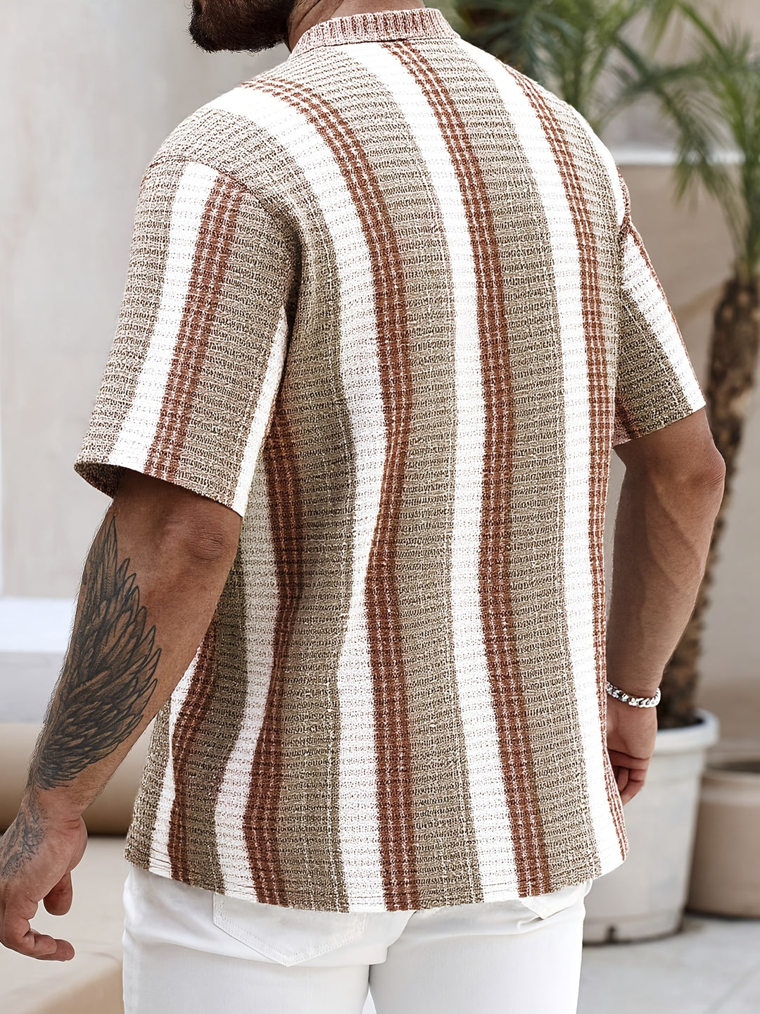Back view of brown and white striped short sleeve button up shirt for men
