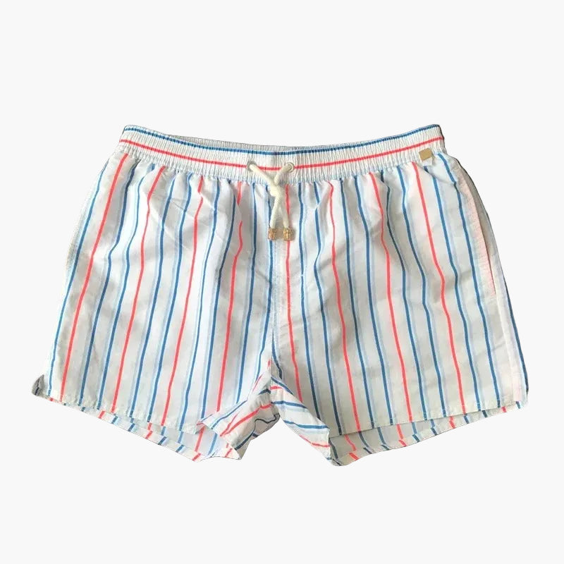 White swim shorts with thin blue and coral stripes, elastic waist, and drawstring