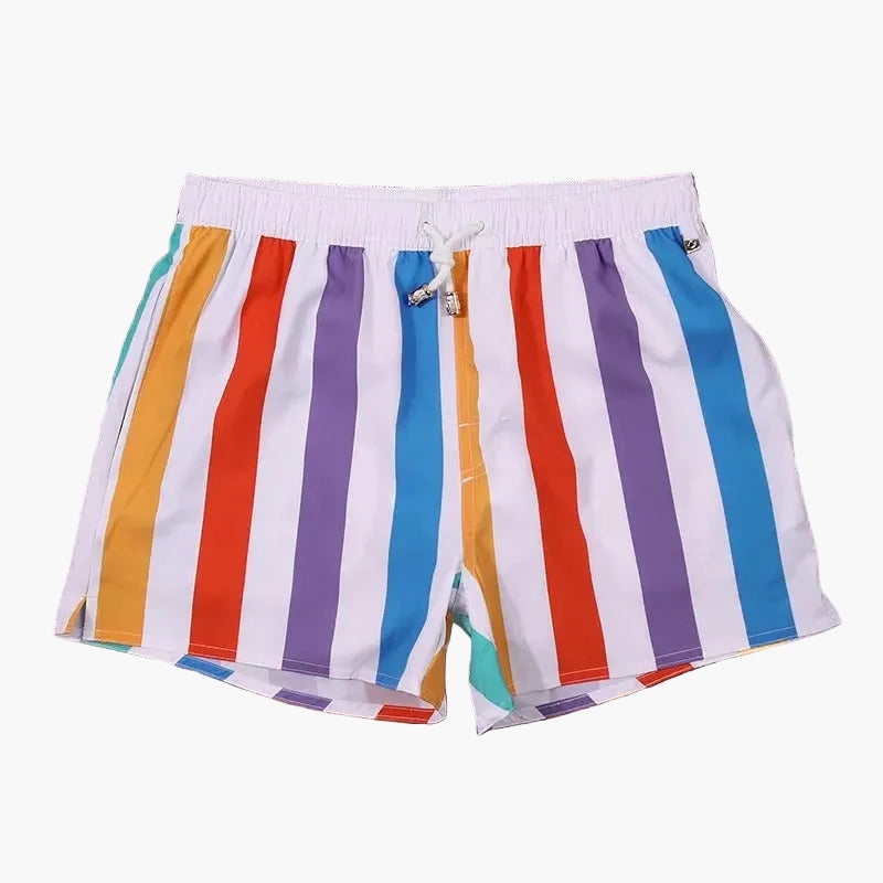 White swim shorts with bold multicolor vertical stripes and elastic waistband