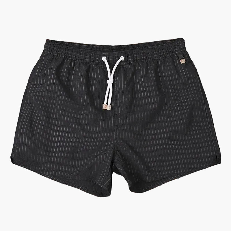 Black swim shorts with тонal pinstripes, elastic waistband, and white drawstring