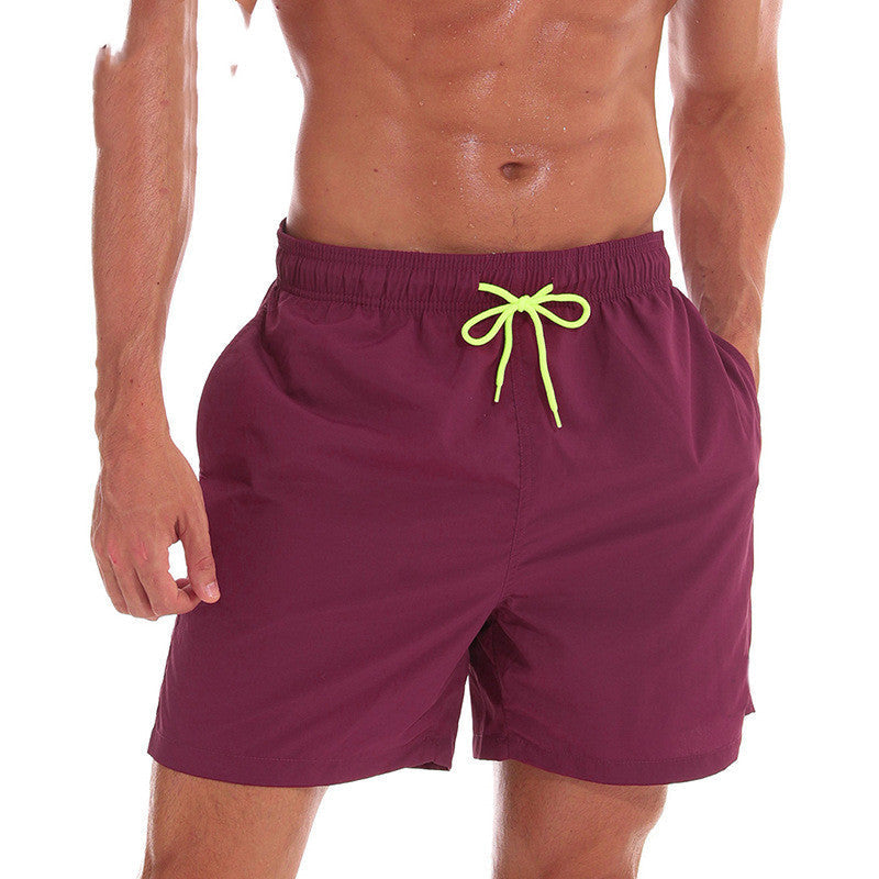 Maroon men's swim shorts with lime drawstring and relaxed fit, beach shorts