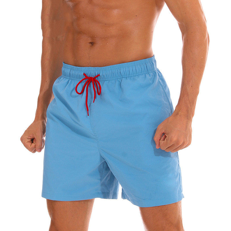 Light blue men's swim shorts with red drawstring and side pockets, bathing suit