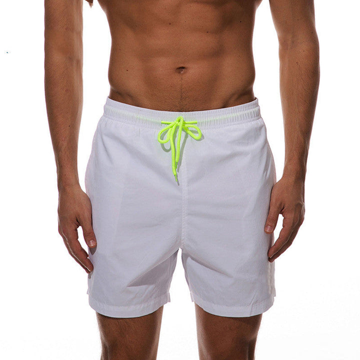 White men's swim shorts with bright green drawstring, front view summer bathing suit shorts