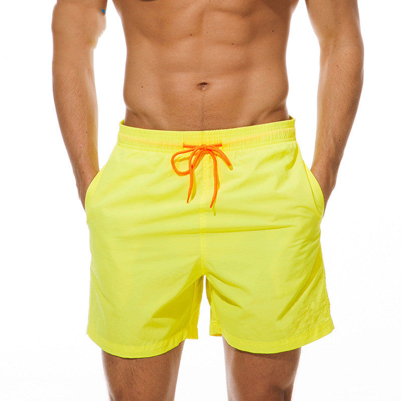 Neon yellow men's swim shorts with orange drawstring, front view summer swim shorts