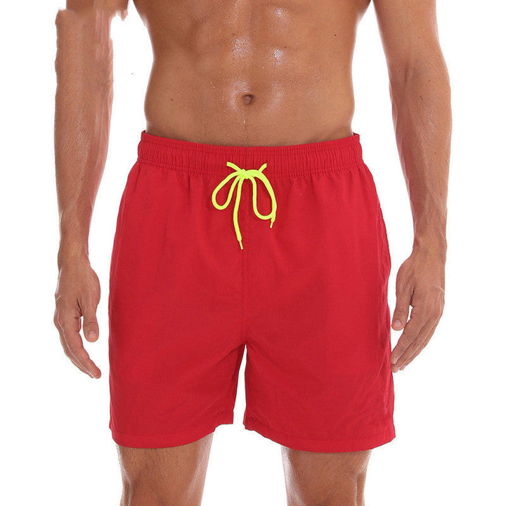 Red men's swim shorts with neon yellow drawstring, front view beach shorts