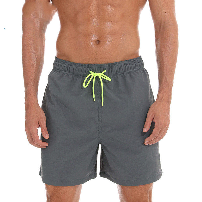 Gray men's swim shorts with neon green drawstring, front view summer bathing suit shorts