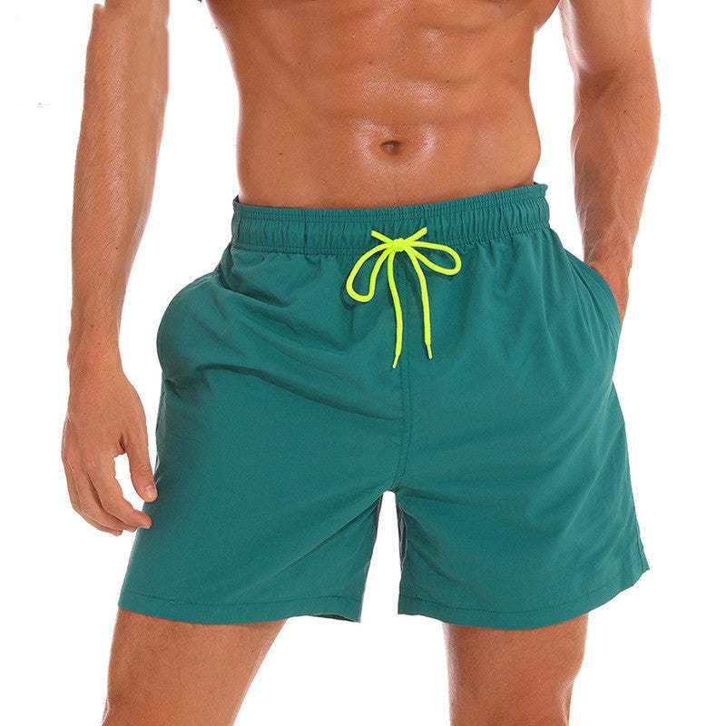 Teal men's swim shorts with neon drawstring and side pockets, summer swim shorts