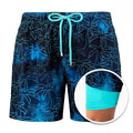 Navy palm print men's swim shorts with drawstring waist and built-in liner inset