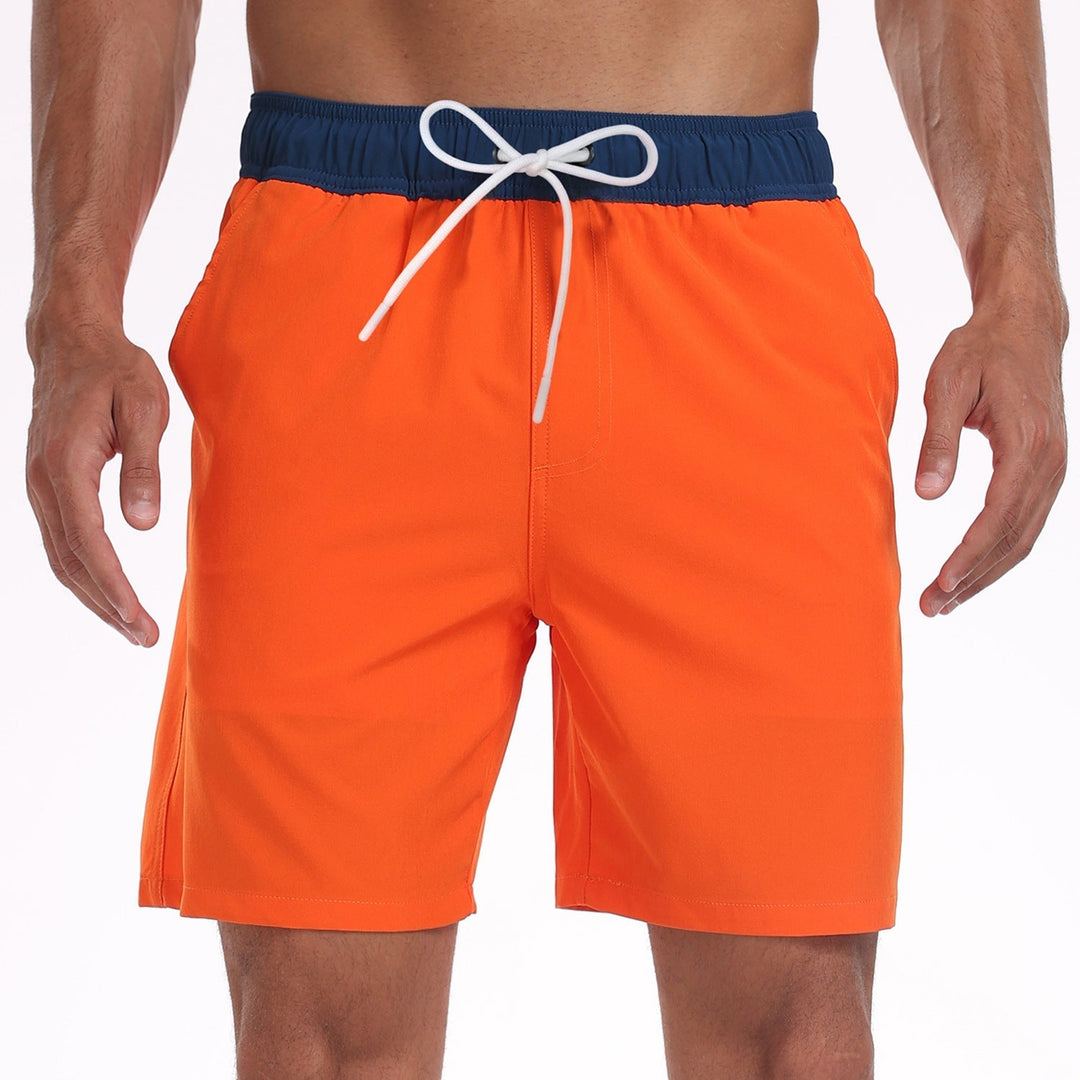 Bright orange men's swim shorts with navy waistband and white drawstring, sporty beach shorts