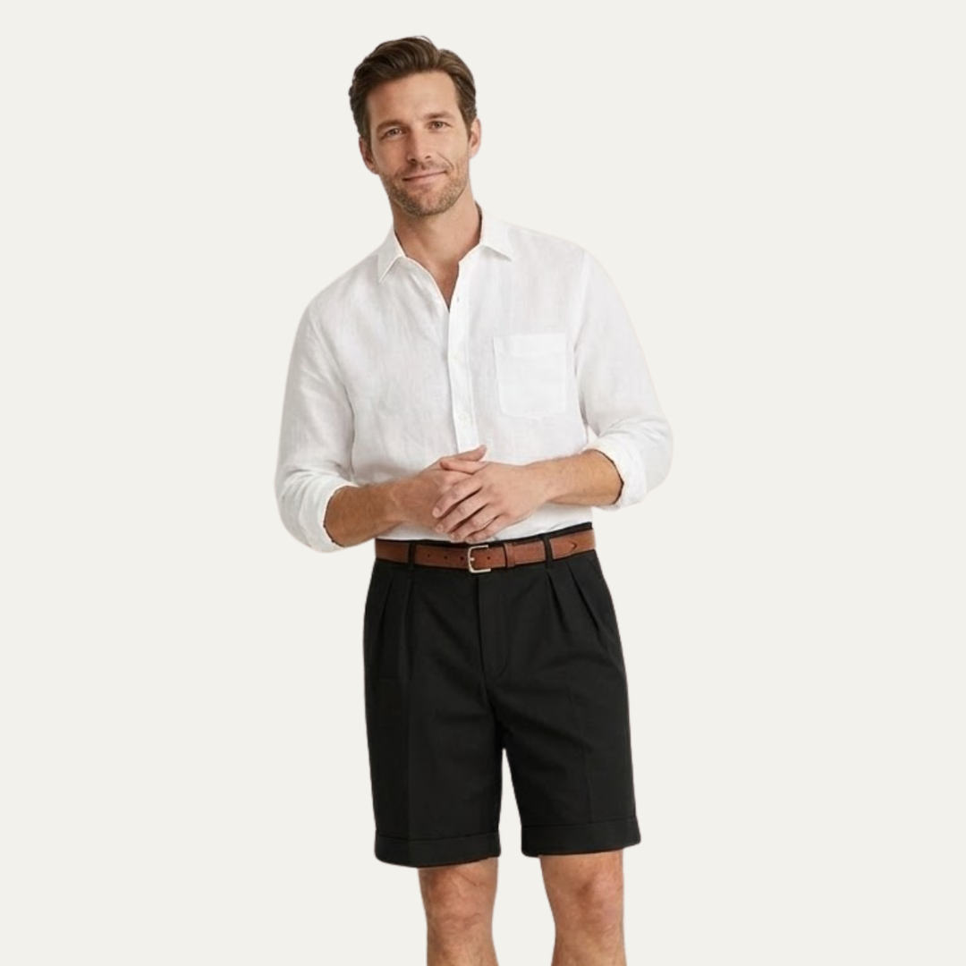 Model wearing black men's summer tailored linen shorts with white shirt