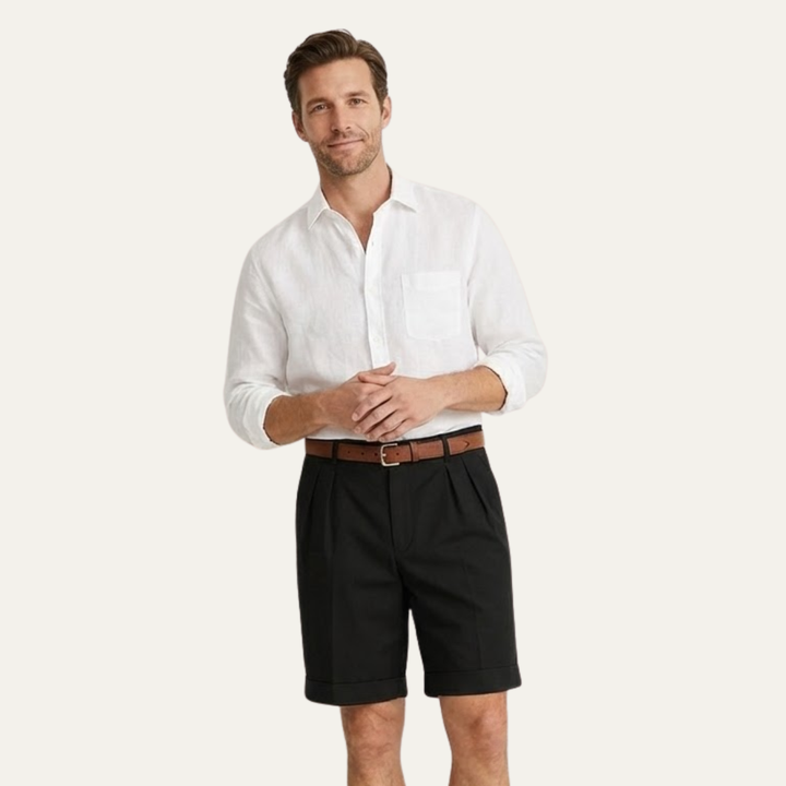 Model wearing black men's summer tailored linen shorts with white shirt