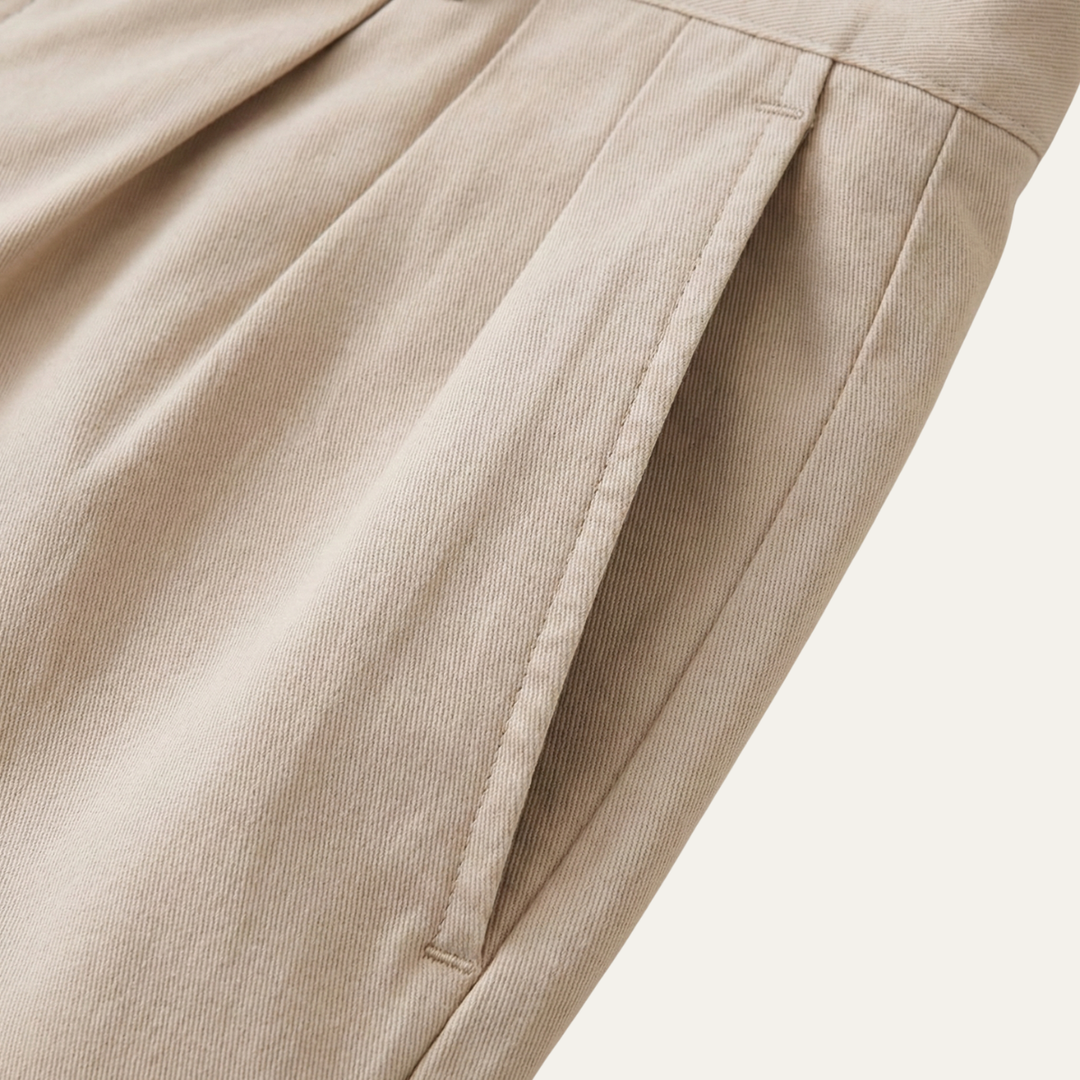Side detail of men's linen shorts showing clean seams and angled pocket opening