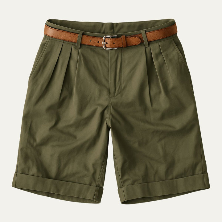 Olive green tailored linen shorts with pleats, cuffed hems, and brown belt