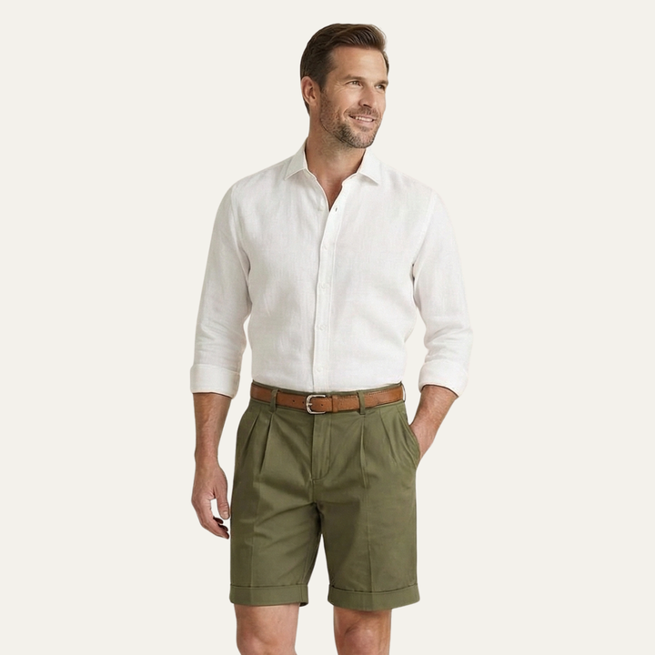 Model wearing olive men's summer tailored linen shorts with white shirt