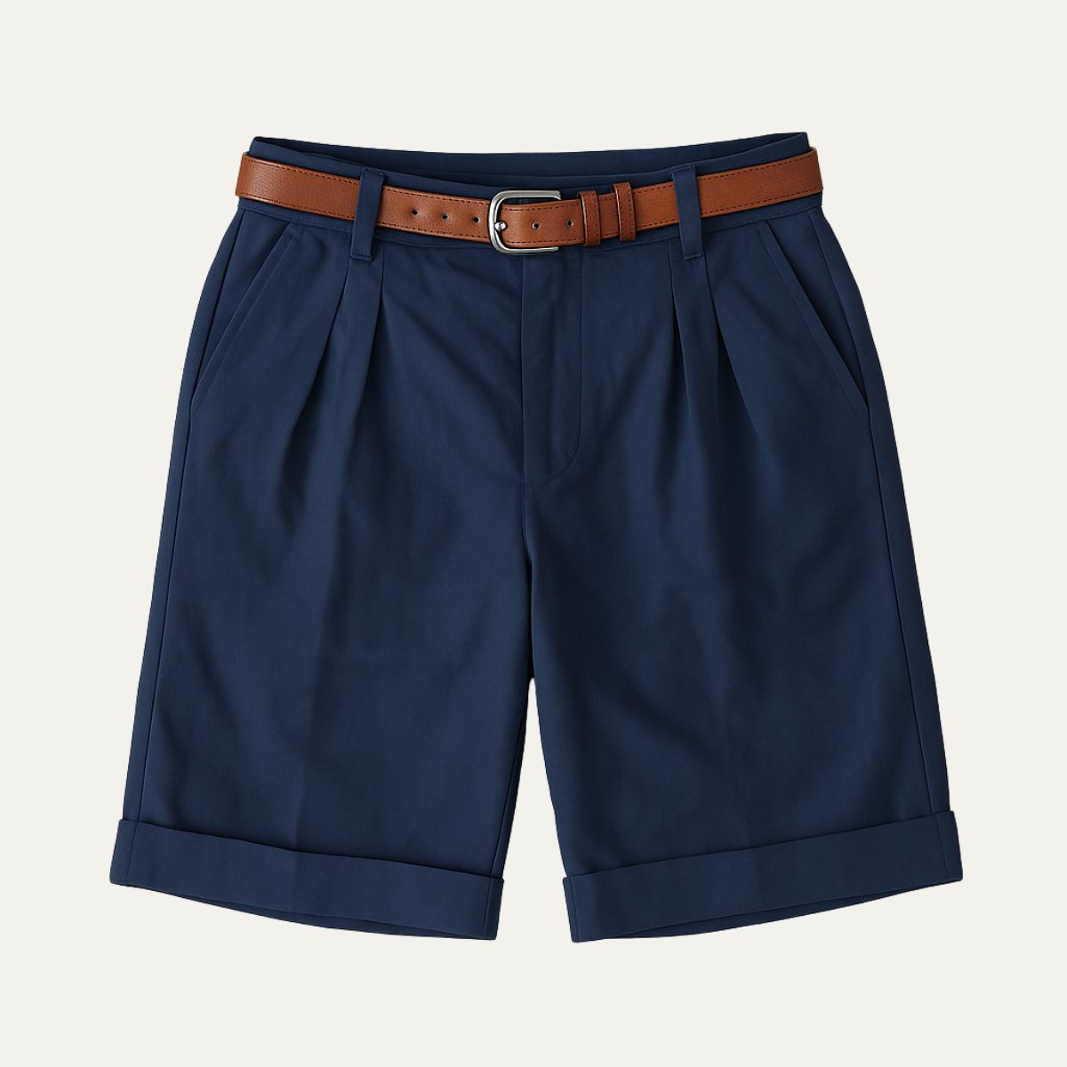 Navy tailored linen shorts with pleats, cuffed hems, and brown belt