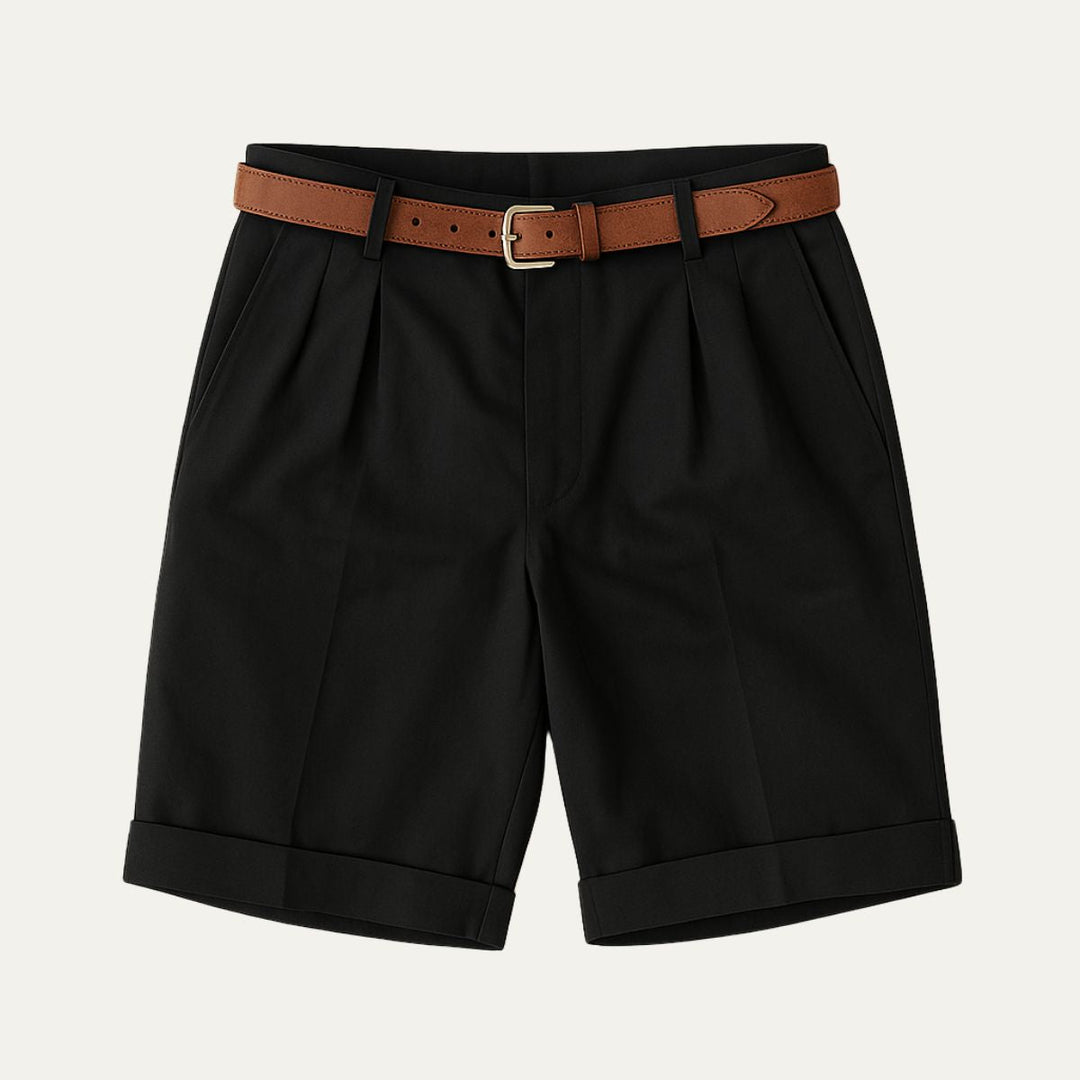 Black tailored linen shorts with pleats, cuffed hems, and brown belt