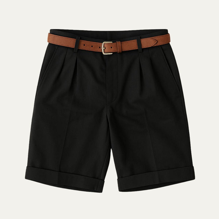 Black tailored linen shorts with pleats, cuffed hems, and brown belt