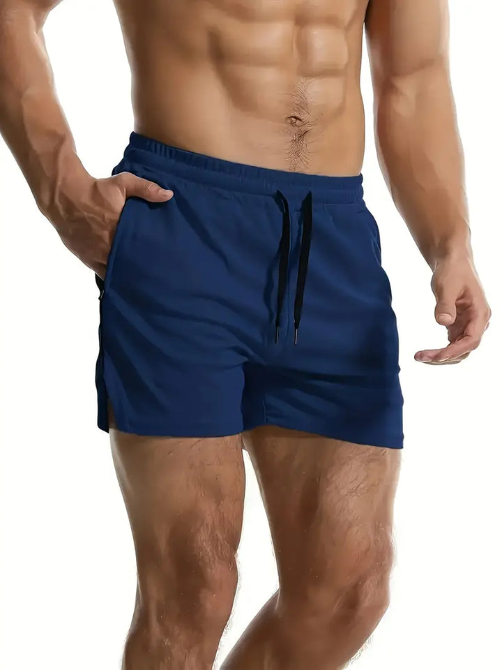Navy men's swim shorts with quick dry finish, adjustable drawstring waist and relaxed fit