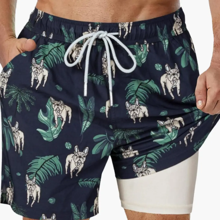 Navy men's tropical swim shorts with bulldog print, palm leaves, and mesh lining