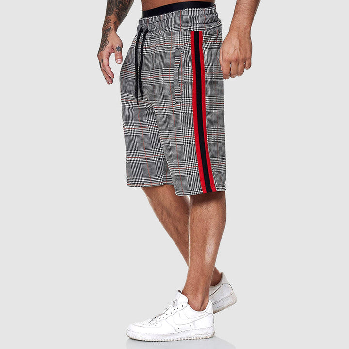 Burgundy athletic shorts with drawstring waist and zip pocket, sporty summer pants detail