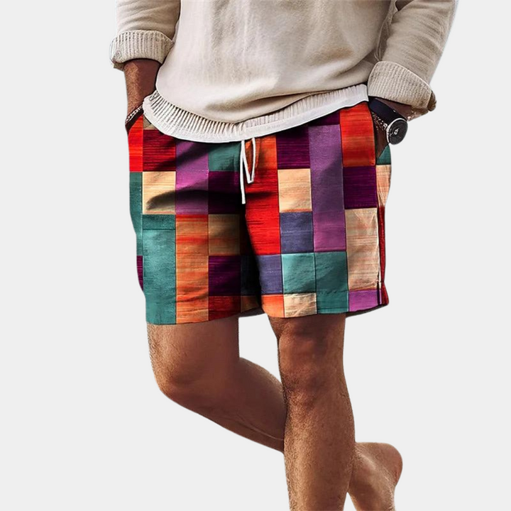 Orange swim shorts with navy waistband and white drawstring, swimsuit shorts close-up