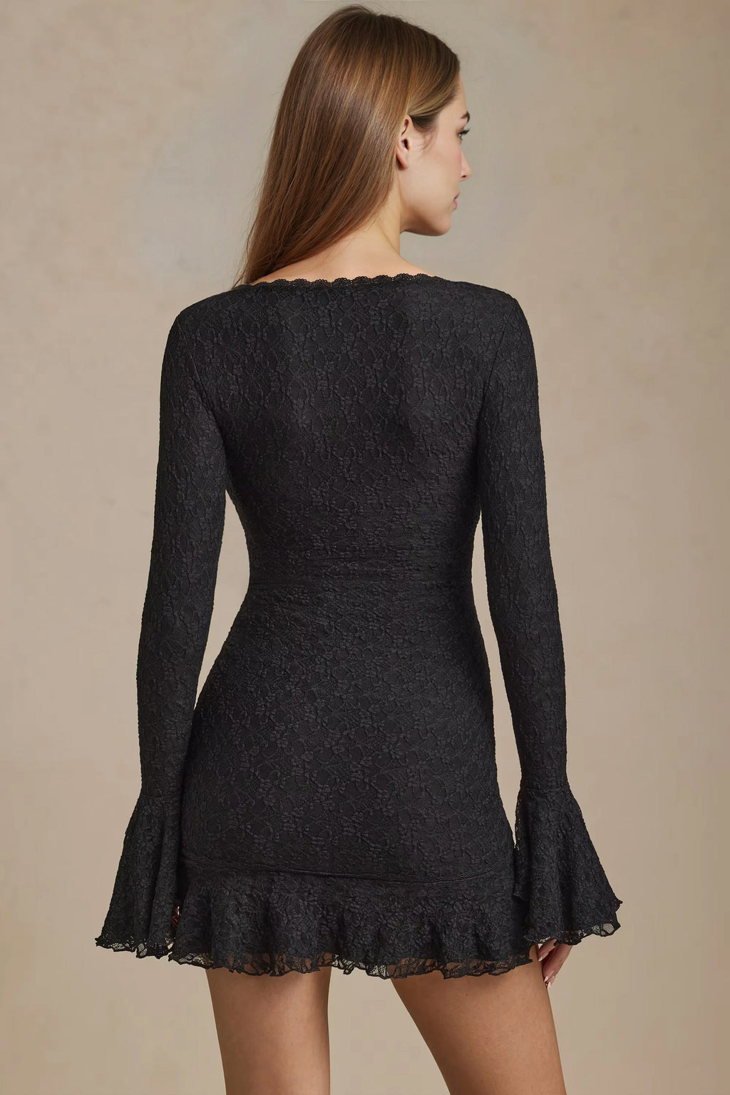 Black cocktail mini dress with long sleeves and ruffle hem for women