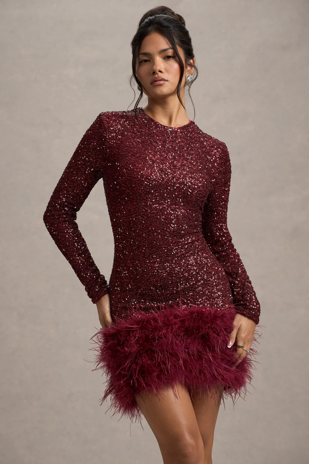 Burgundy sequin long sleeve mini dress with feather hem, cocktail party front close-up