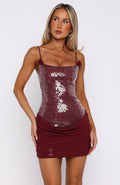Burgundy sequin square neck mini dress with spaghetti straps and rosette details, front close-up