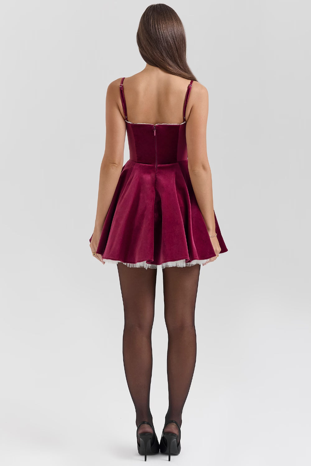 Back view burgundy sweetheart mini skater dress with thin straps, center zipper, and flared skirt