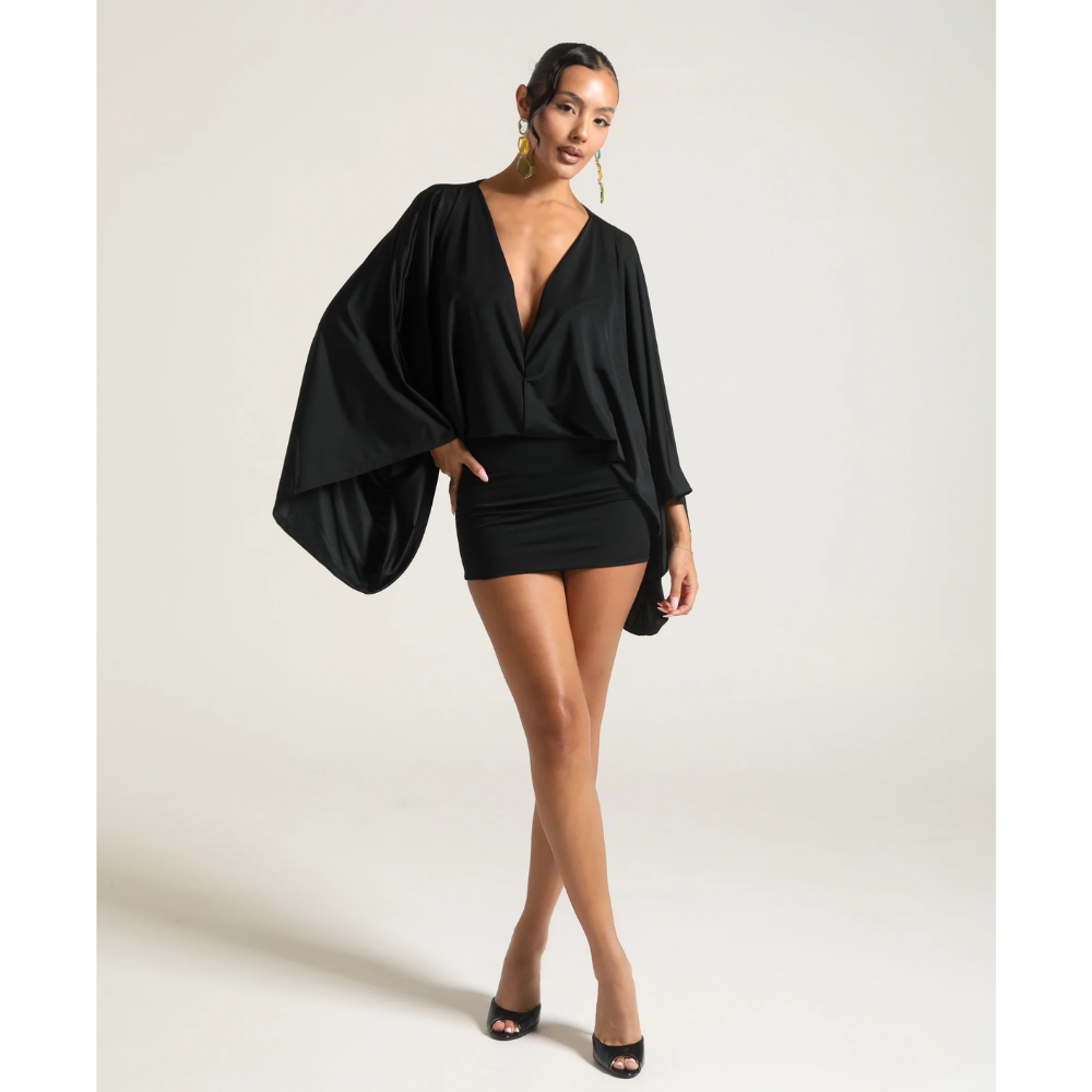 Black V neck mini dress with oversized draped sleeves and fitted cocktail skirt