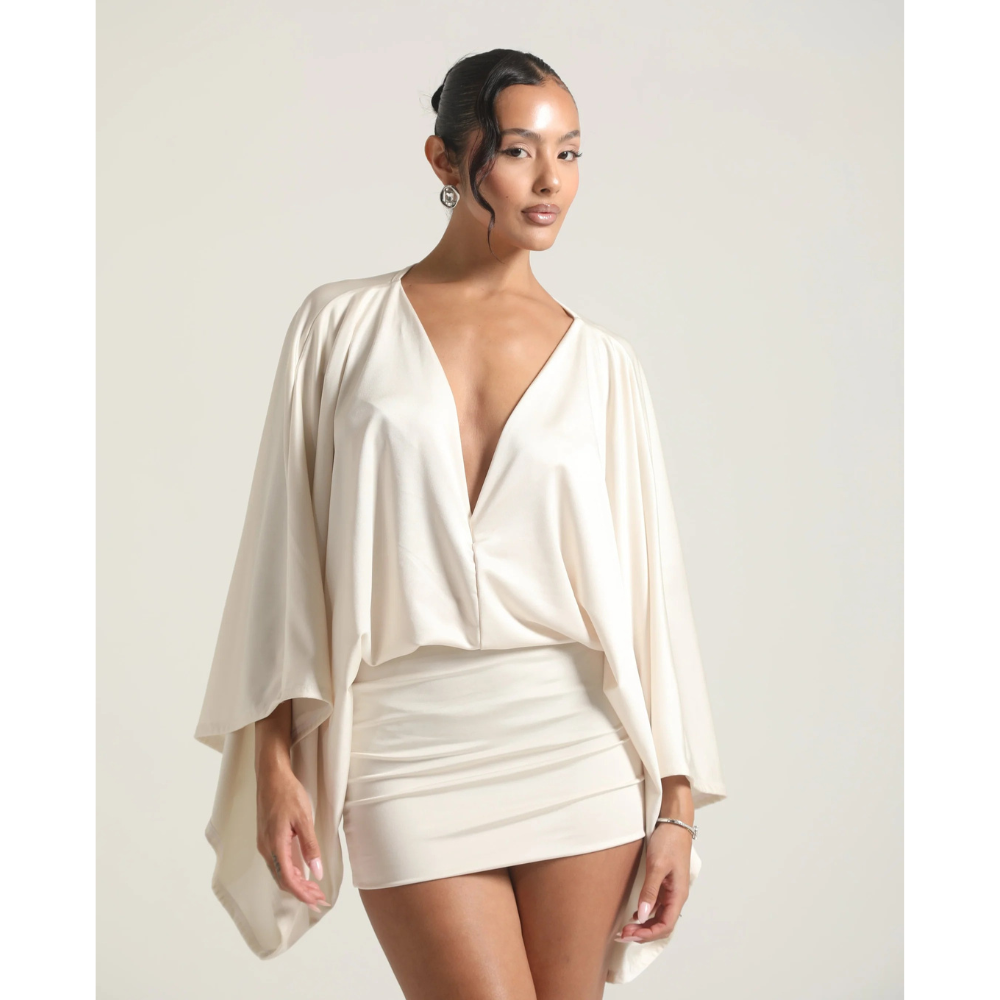 Ivory V neck mini dress with draped sleeves and fitted skirt, front view
